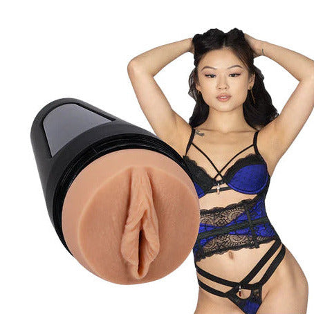 Woman in blue lingerie holding a masturbator with a beige interior on a white background
