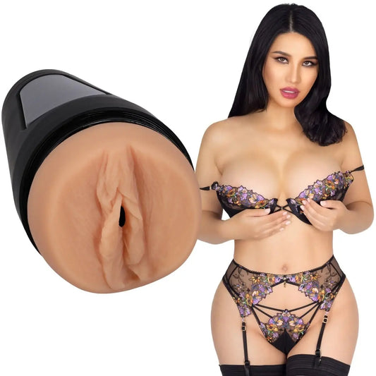 Woman in lingerie with close-up of a realistic silicone vagina on a white background