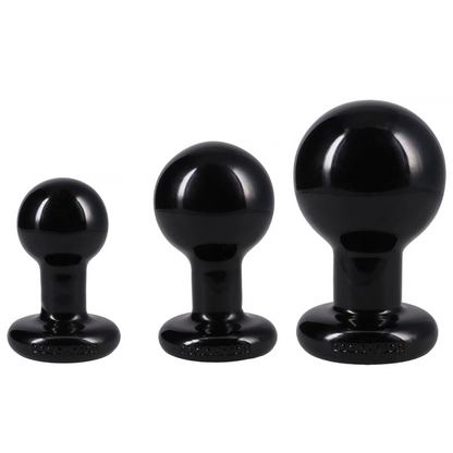 Three black silicone butt plugs in graduated sizes, arranged from smallest to largest against a plain white background.