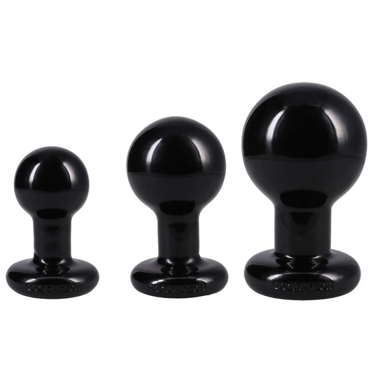 Three black silicone butt plugs in graduated sizes, arranged from smallest to largest against a plain white background.