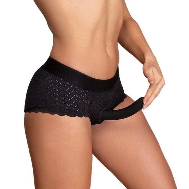 Black lace-trimmed underwear strap-on worn by a model on a white background