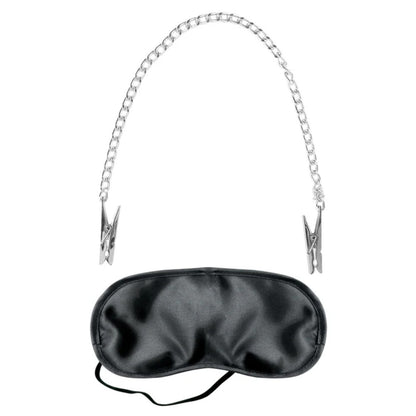 Black satin eye mask with metal nipple clips on a white background