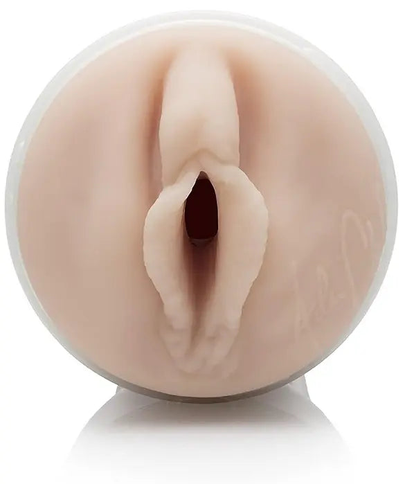 Realistic silicone model of a female reproductive organ on a white background