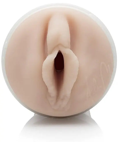 Realistic silicone model of a female reproductive organ on a white background