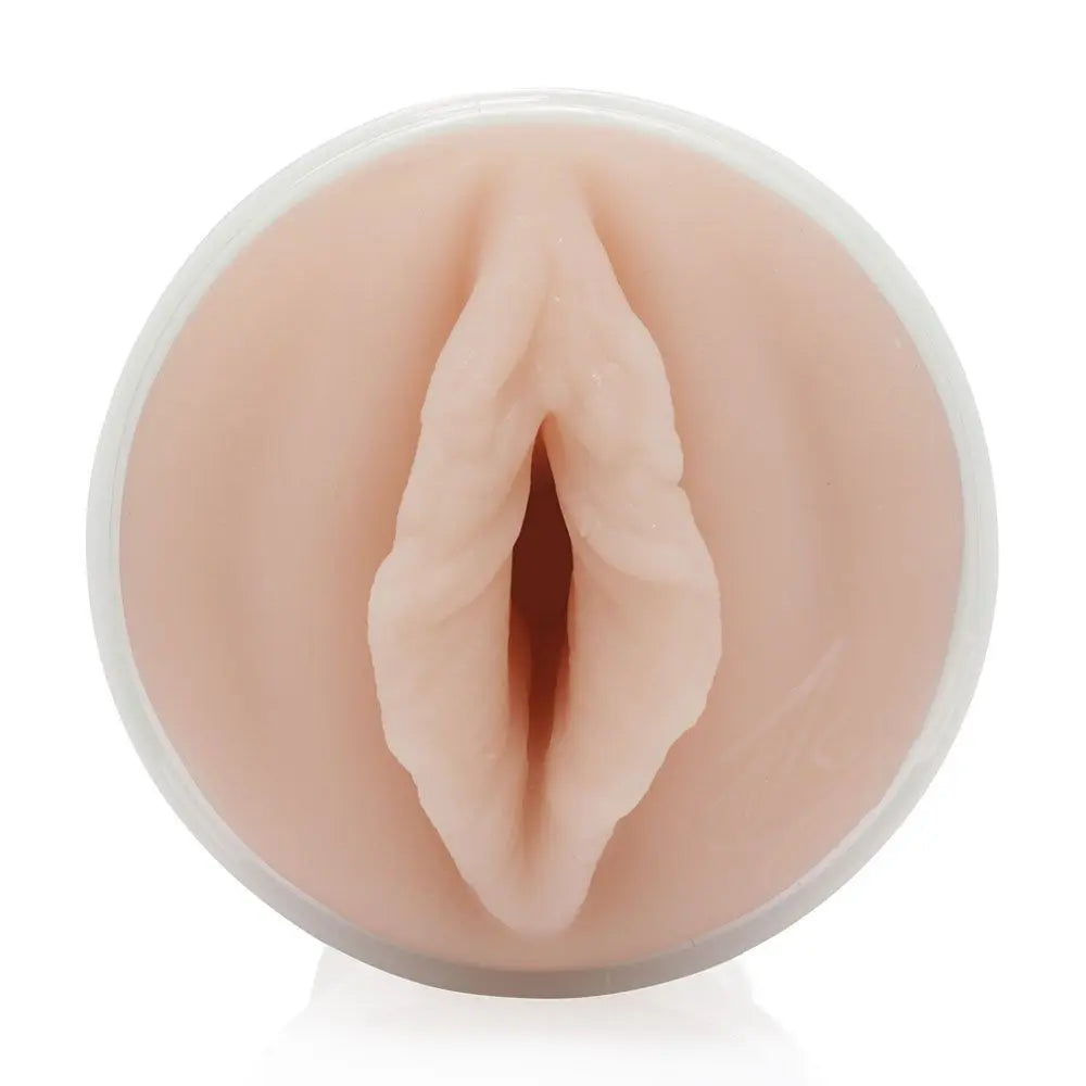 Realistic silicone model of a female genitalia on a white background