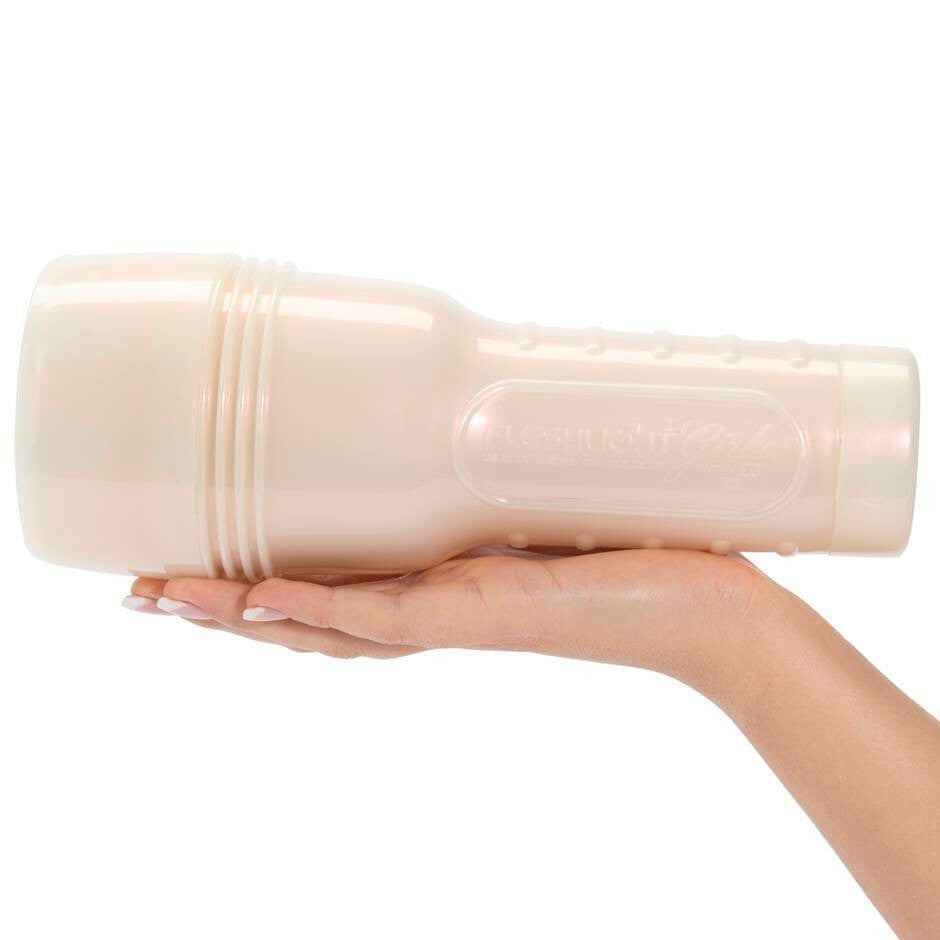 Hand holding a masturbator against a white background