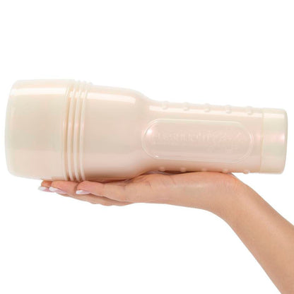 Hand holding a masturbator against a white background