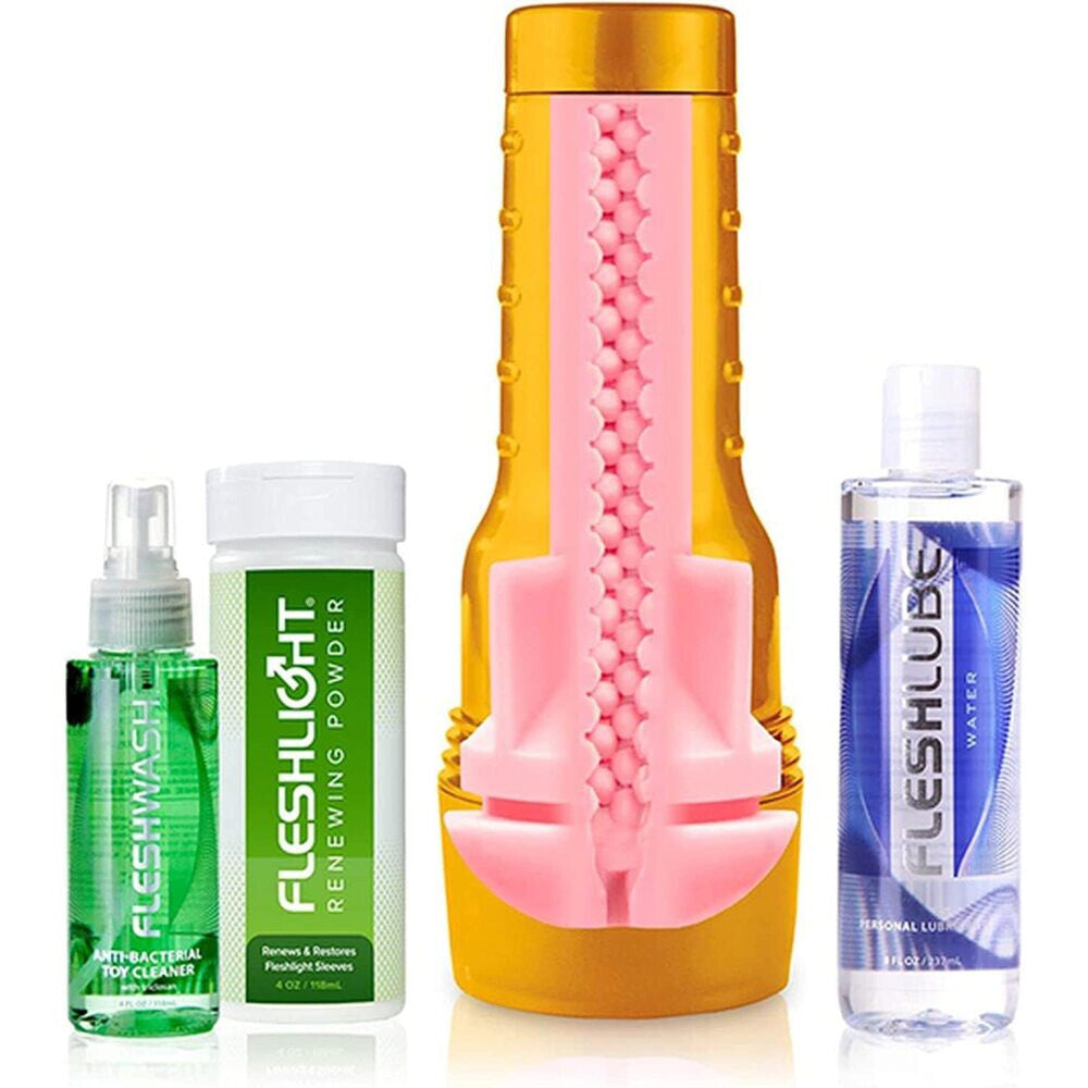 Collection of Fleshlight products including a toy, cleaning spray, powder, and lube on a white background.