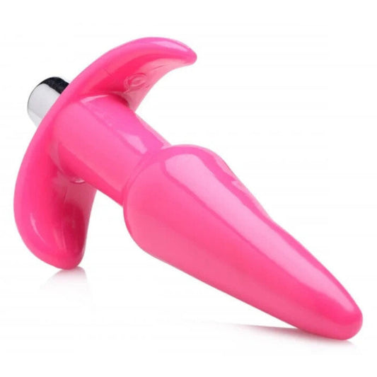 Pink vibrating anal plug on a white background