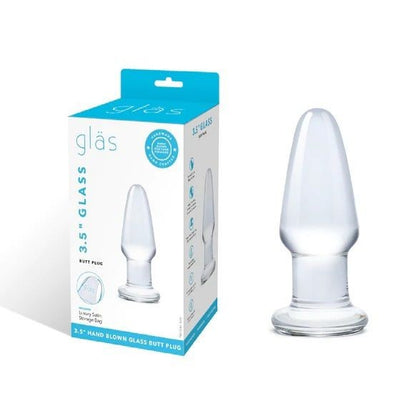 Clear glass butt plug with packaging labeled 'glas' on a white background
