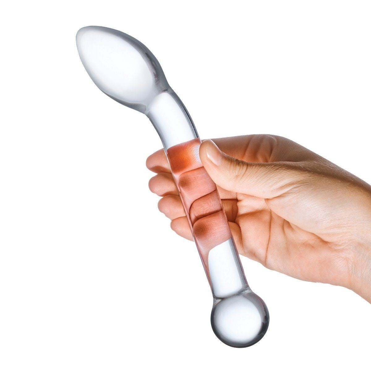 Hand holding a clear glass dildo with a white handle on a white background
