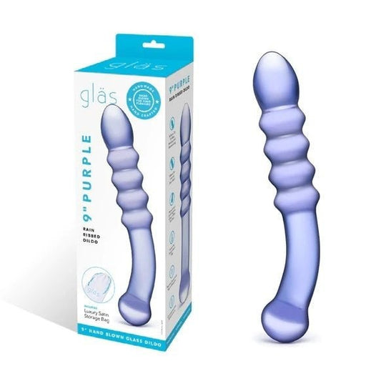 Purple glass sex toy with packaging labeled 'glas' on a white background