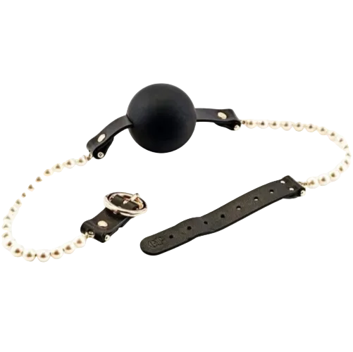 Black ball gag with a leather strap and pearl beaded chain on a white background