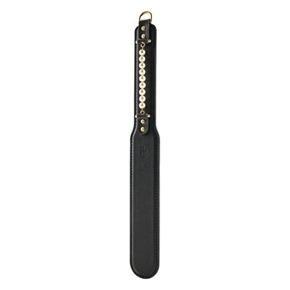 Black leather paddle with pearl handle on a white background