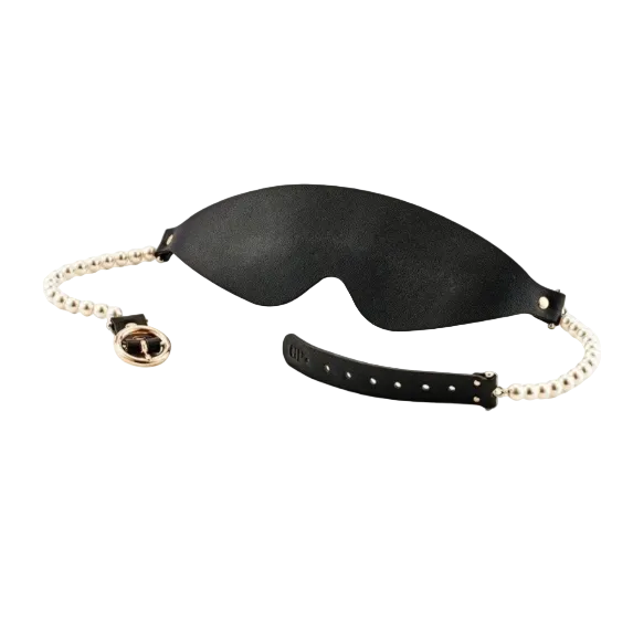 Black leather blindfold with gold and pearl chain on a white background