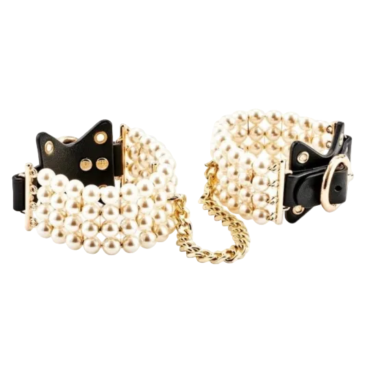 Pair of pearl and chain cuffs on a white background