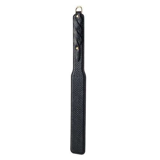 Black leather paddle with textured handle on a white background