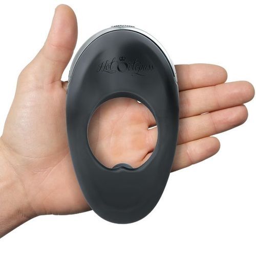 Black silicone ring with 'Hot Octopuss' branding held in a hand against a white background