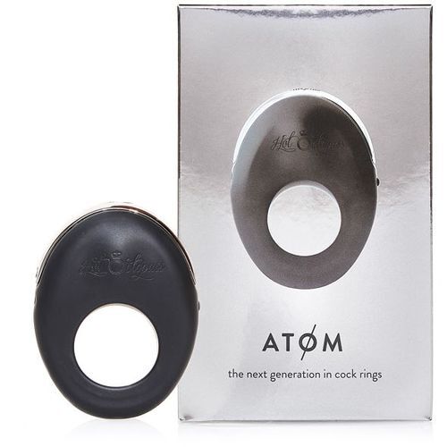 Black cock ring with packaging labeled 'Atom' on a white background