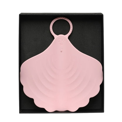 Pink silicone product with a ring on top in a black box
