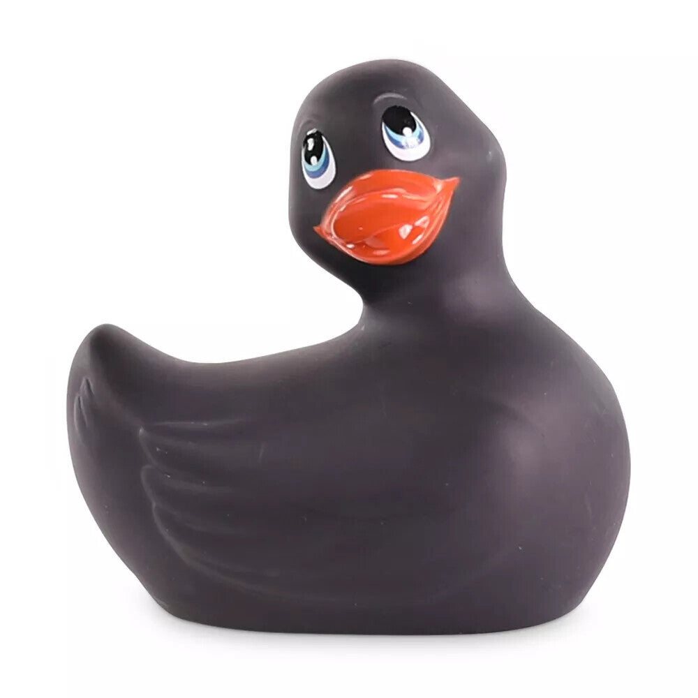 Black rubber duck with a red beak on a white background