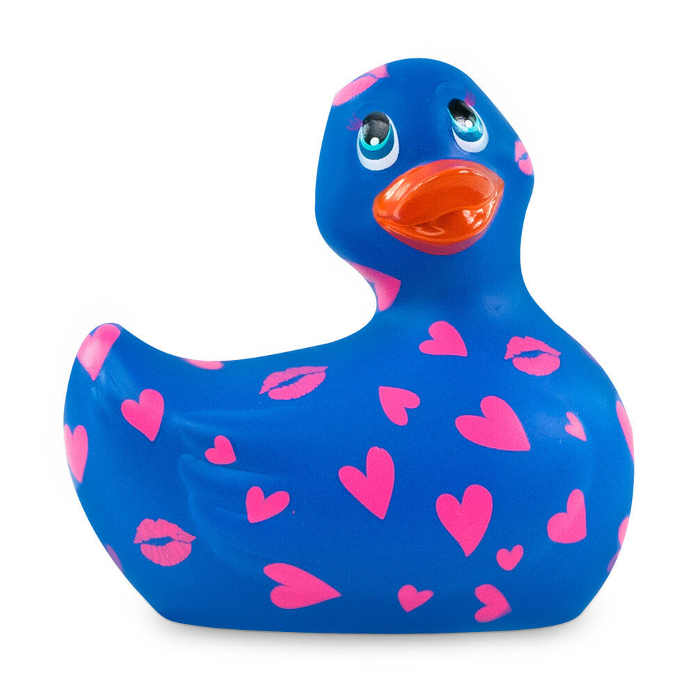 Blue rubber duck with pink hearts and lips on a white background
