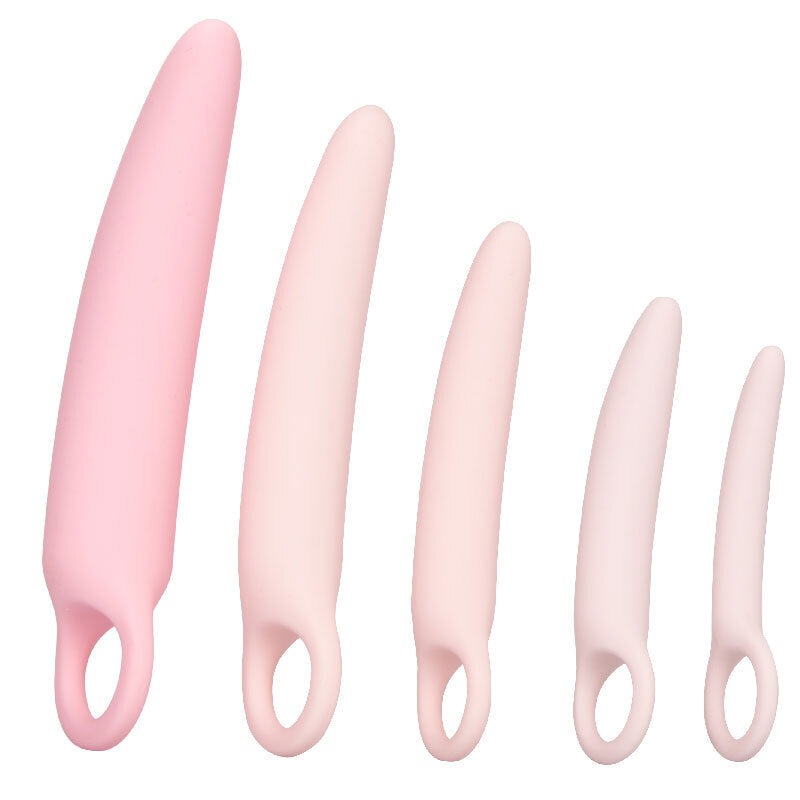 Set of five pink silicone tools with handles on a white background