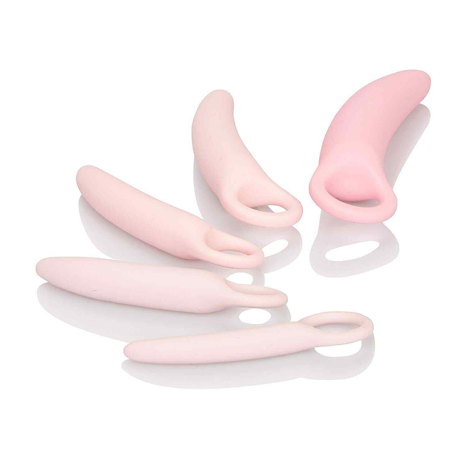 Set of pink silicone tools on a white background