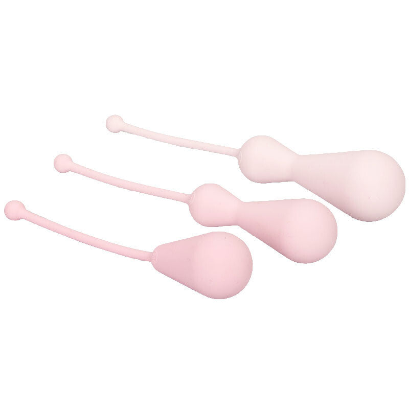 Set of four pink silicone weights on a white background