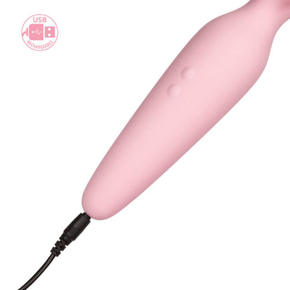Pink cylindrical device with USB cable on a white background