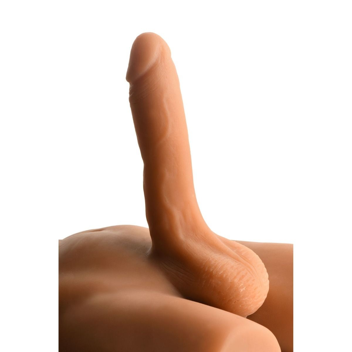 Close-up of a dildo and masturbator on a white background