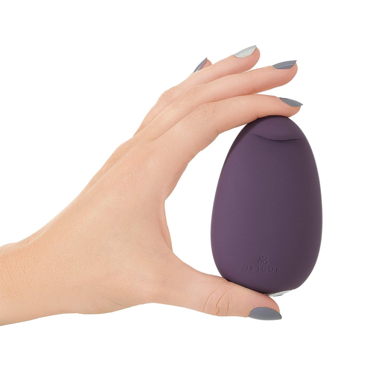 Hand holding a purple egg-shaped massager with a brand logo on a white background
