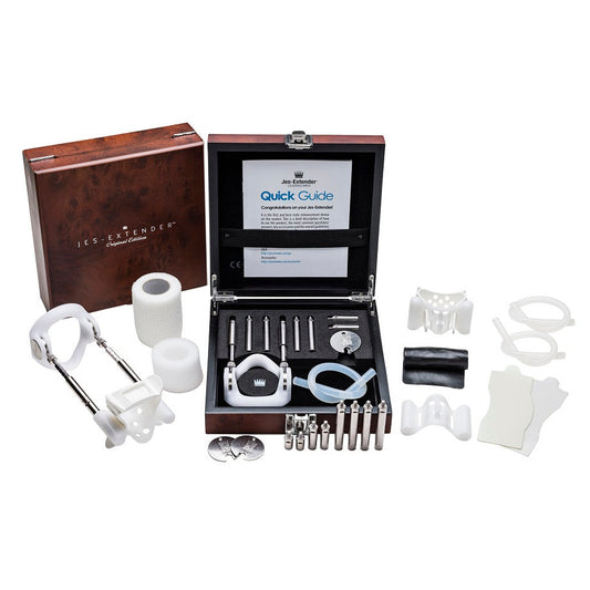 Set of medical devices and accessories in a wooden box with 'Les Extender' branding.