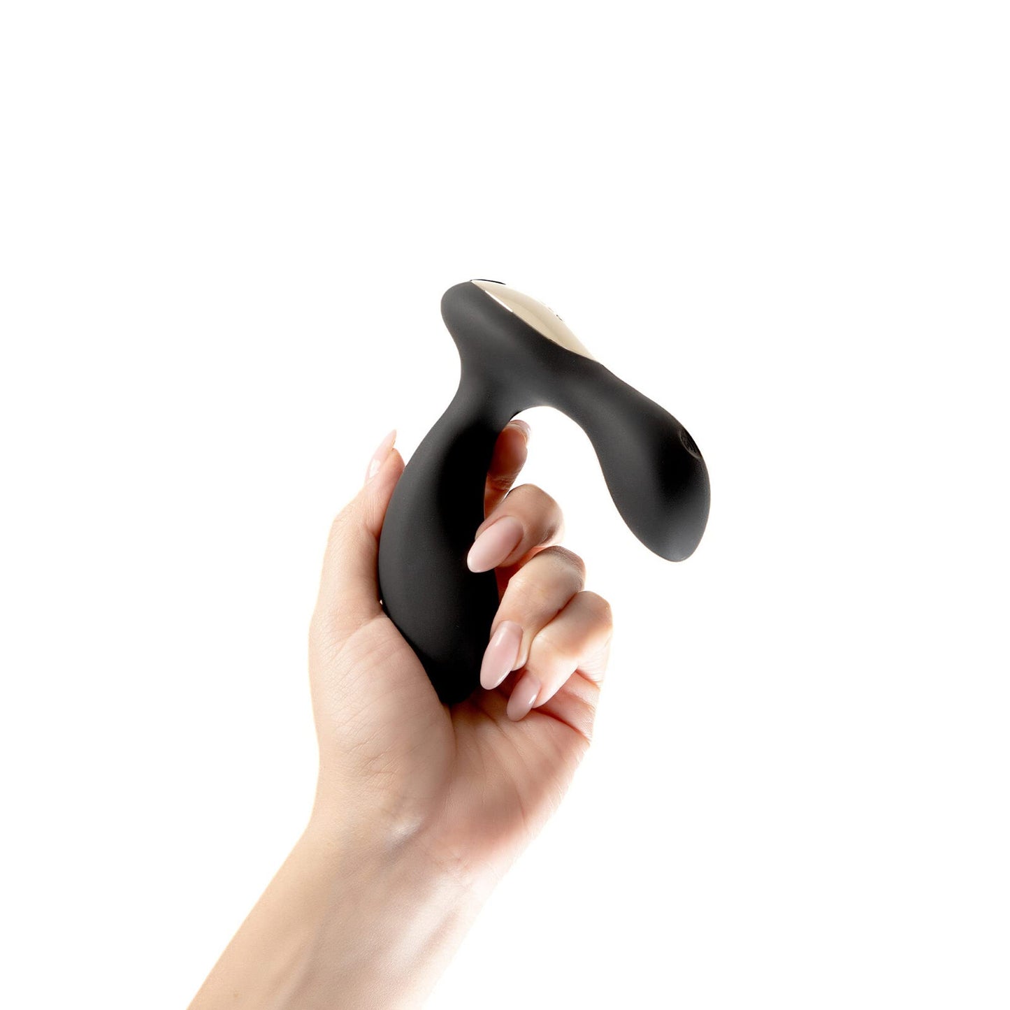 Hand holding a black and white handheld device against a white background