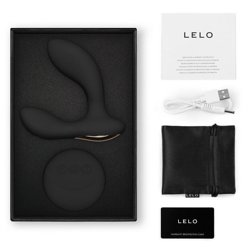 LELO product set with black device, charging cable, and packaging on a white background