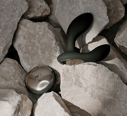 Black and silver device on a rocky surface