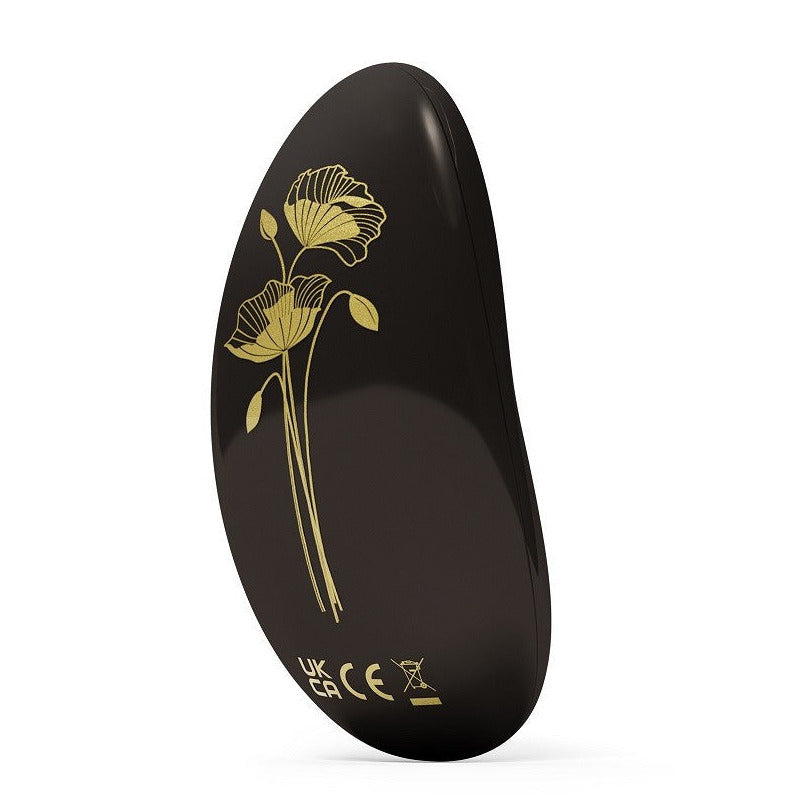 Black device with gold floral design on a white background