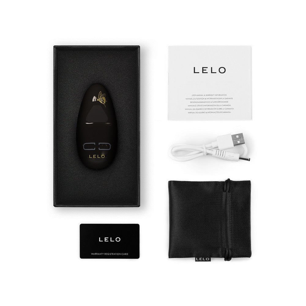 LELO product with packaging, USB cable, and warranty card on a white background