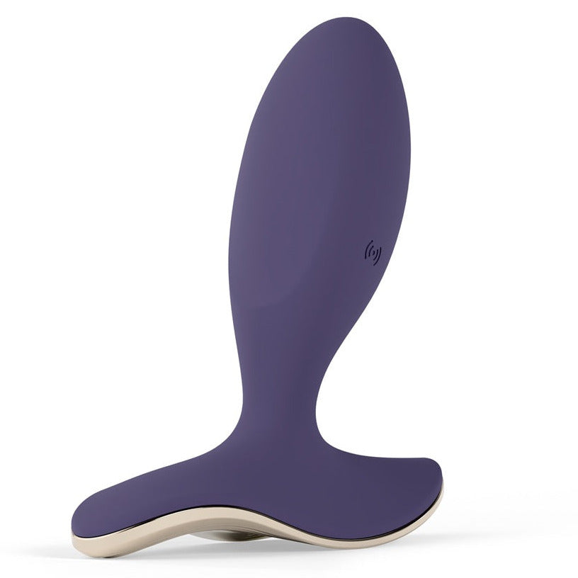 Purple and beige anal plug on a white background