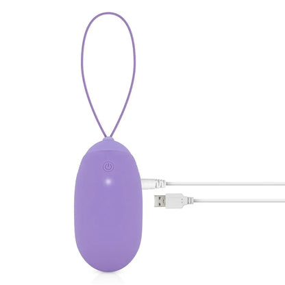 Purple portable massage device with USB cable on a white background