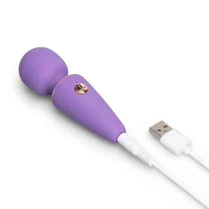 Purple electronic massage device with USB cable on a white background