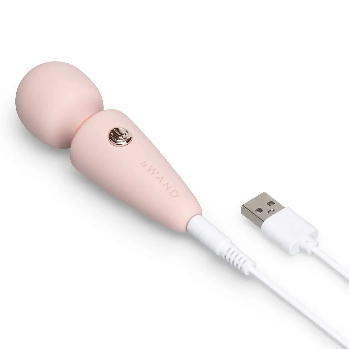 Pink electronic massage device with USB cable on a white background