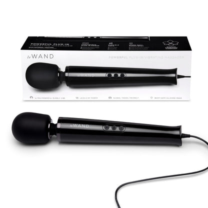 Black handheld electronic device with packaging labeled 'Le Wand' on a white background