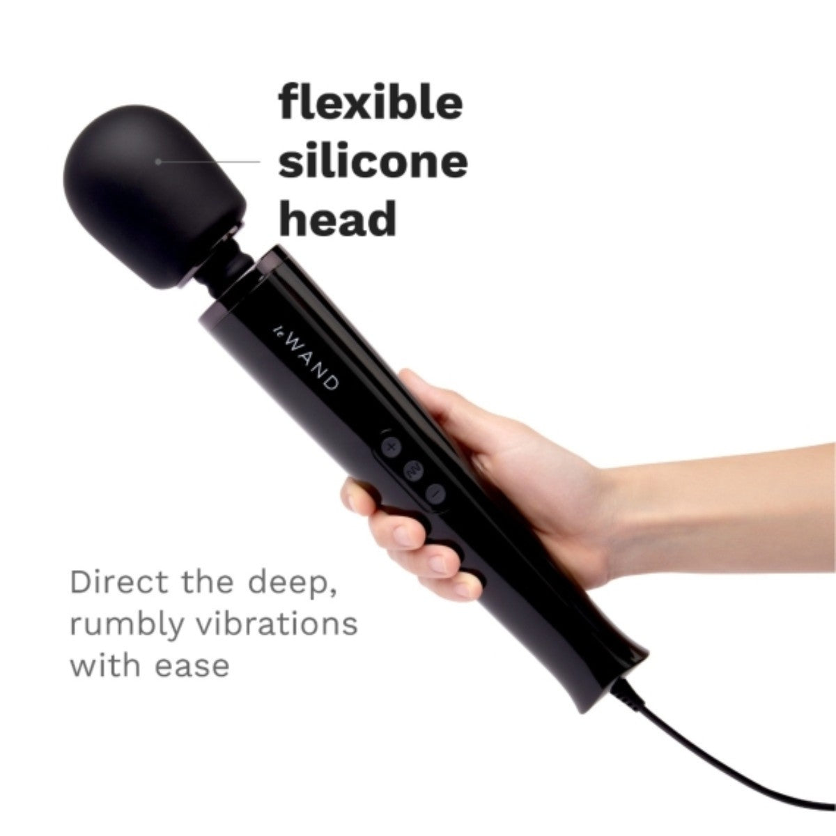 Black handheld massager with flexible silicone head held by a hand on a white background