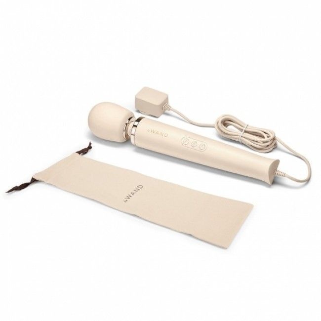 Beige electronic device with a cord and packaging on a white background