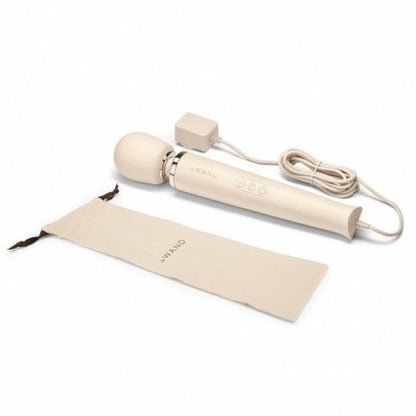 Beige electronic device with a cord and packaging on a white background