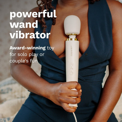 Woman holding a cream handheld vibrator with text about its use and features.