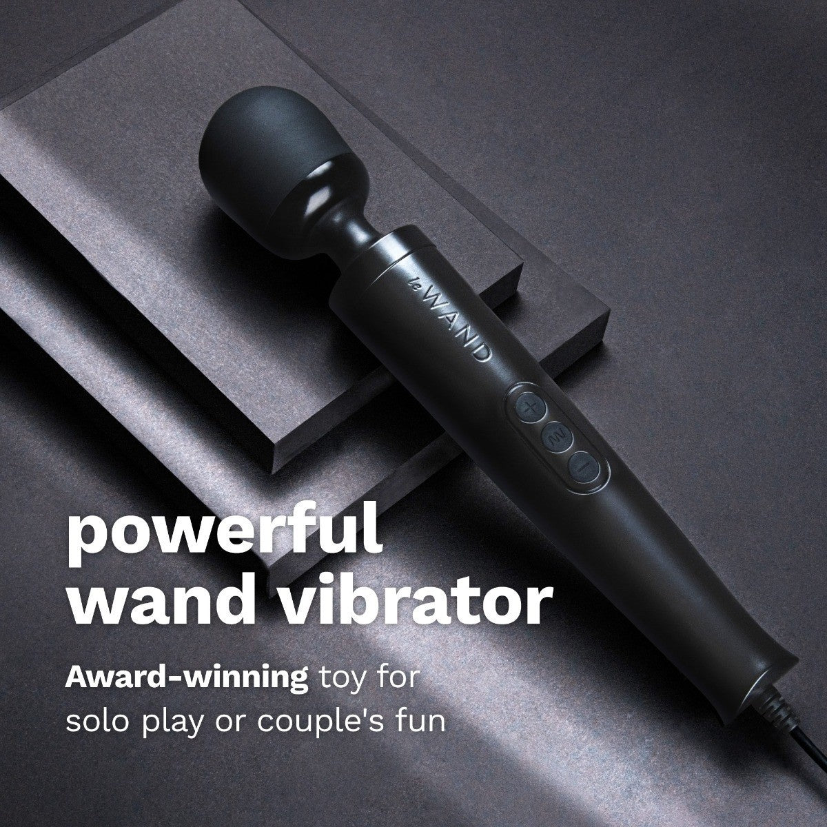Black wand vibrator on a dark surface with text highlighting its features.