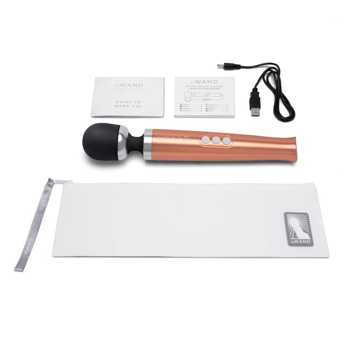 Rose gold handheld massager with USB cable, user guide, and storage bag on a white background
