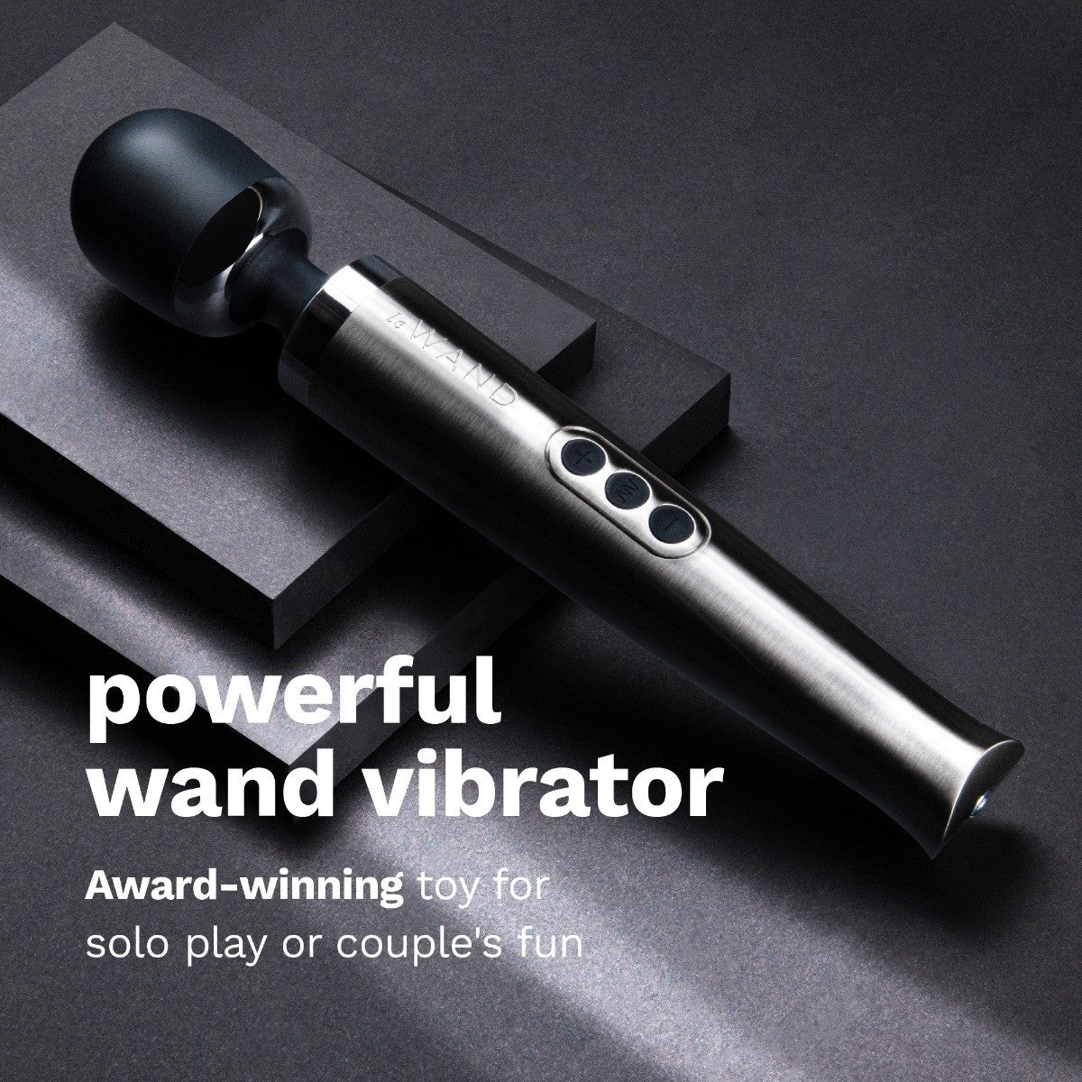 Black and silver wand vibrator on a dark background with text highlighting its features.